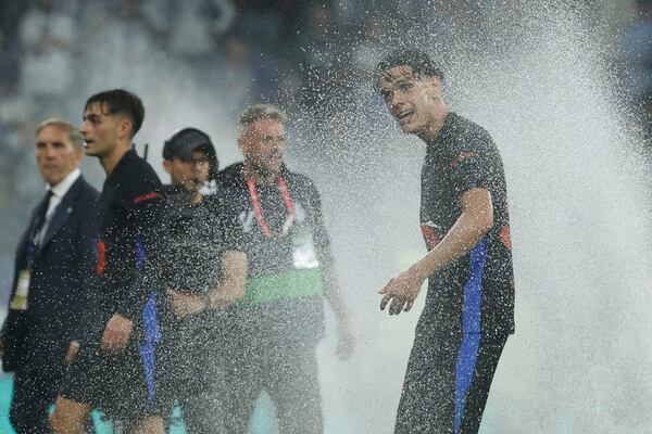 Barcelona's Hector Fort celebrates at the end of the Spanish La Liga soccer match between Barcelona and Espanyol at Lluis Companys Olympic Stadium in Barcelona, Spain, Thursday, May 15, 2025. (AP Photo/Joan Monfort)