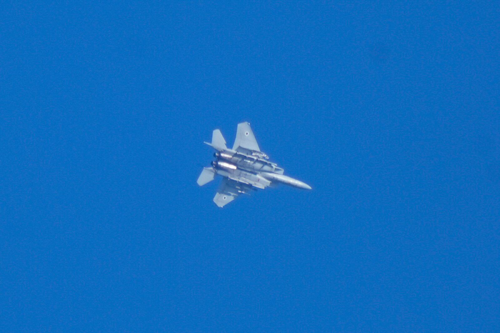 An Israeli fighter jet is seen from Haifa, northern Israel, on Thursday, Sept. 26, 2024. (AP Photo/Baz Ratner)