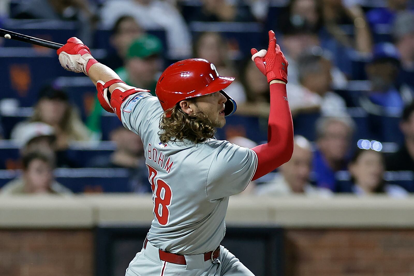 Philadelphia Phillies' Alec Bohm hits a three-run home run during the fourth inning of a baseball game against the New York Mets Friday, Sept. 20, 2024, in New York. (AP Photo/Adam Hunger)