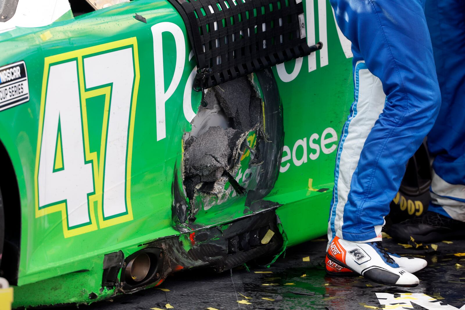 Driver Ricky Stenhouse Jr.'s car shows damage from a wreck in the last few laps of a NASCAR Cup Series auto race at Talladega Superspeedway, Sunday, Oct. 6, 2024, in Talladega, Ala. (AP Photo/ Butch Dill)