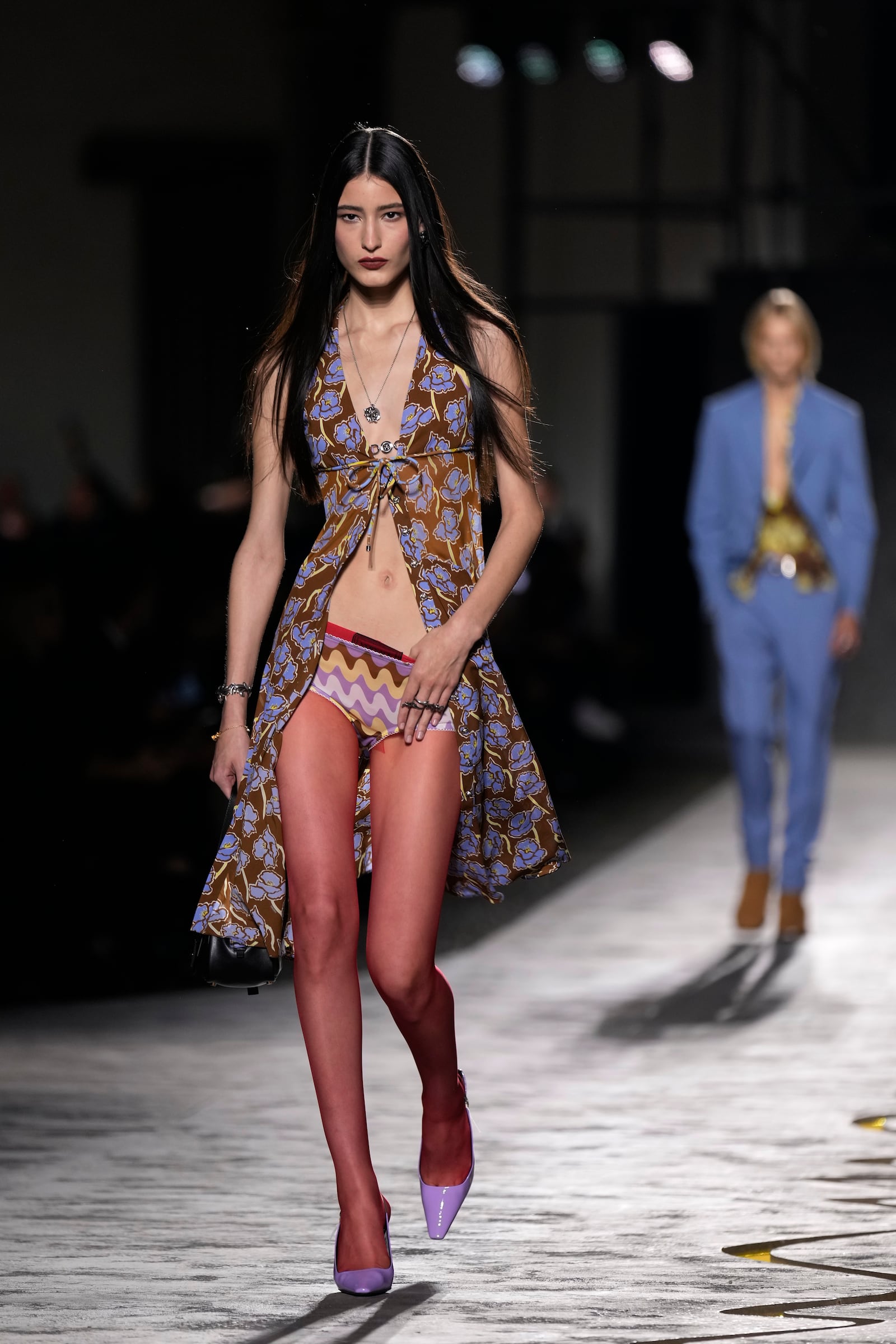 A model wears a creation as part of the Versace Spring Summer 2025 collection, that was presented in Milan, Italy, Friday, Sept. 20, 2024. (AP Photo/Antonio Calanni)