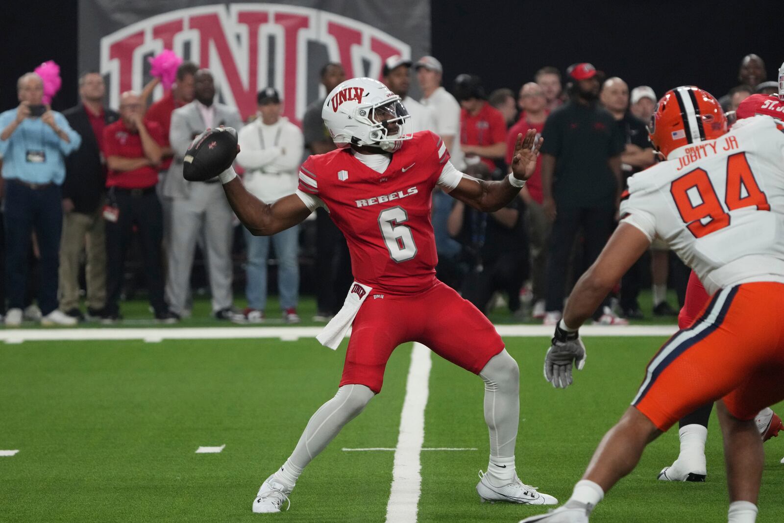 UNLV quarterback Hajj-Malik Williams (6) looks to throw downfield against Syracuse in the first half during an NCAA college football game, Friday, Oct. 4, 2024, in Las Vegas. (AP Photo/Rick Scuteri)