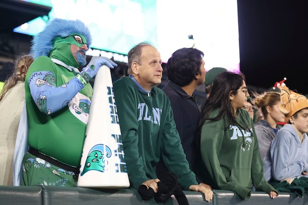 Tulane fans watch their team in the final minutes of a loss to Memphis in the second half of an NCAA college football game in New Orleans, Thursday, Nov. 28, 2024. (AP Photo/Peter Forest)