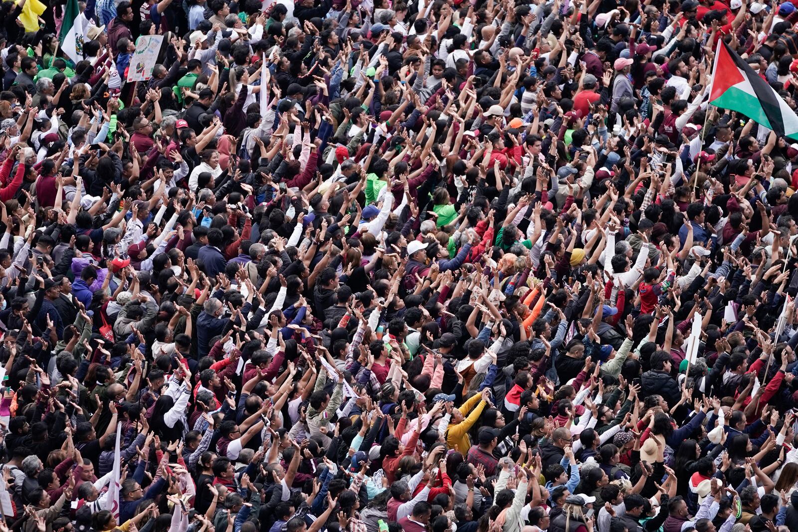 Supporters listen to President Claudia Sheinbaum during a rally in the Zócalo, Mexico City's main square, on her inauguration day, Tuesday, Oct. 1, 2024. (AP Photo/Aurea Del Rosario)