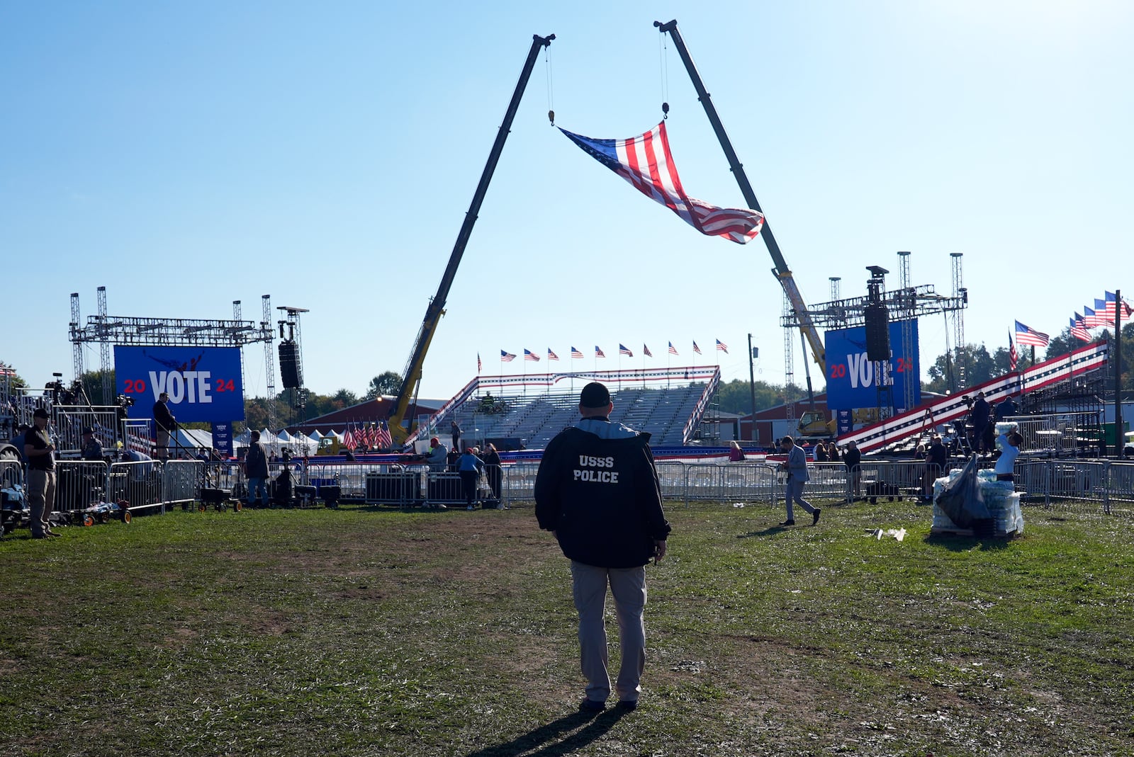 A U.S. Secret Service agent looks at the site before Republican presidential nominee former President Donald Trump speaks at a campaign rally at the Butler Farm Show, the site where a gunman tried to assassinate him in July, Saturday, Oct. 5, 2024, in Butler, Pa. (AP Photo/Alex Brandon)