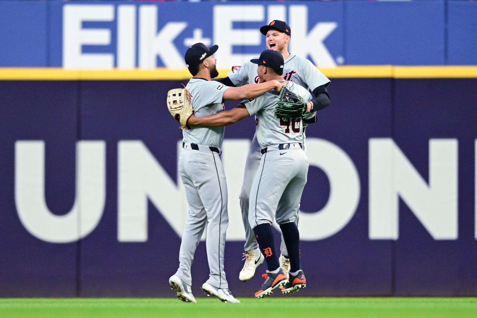 Detroit Tigers' outfielders Riley Greene, left, Wendell Perez, center, and Parker Meadows, right, celebrate after the Tigers defeated the Guardians in Game 2 of baseball's AL Division Series, Monday, Oct. 7, 2024, in Cleveland. (AP Photo/David Dermer)