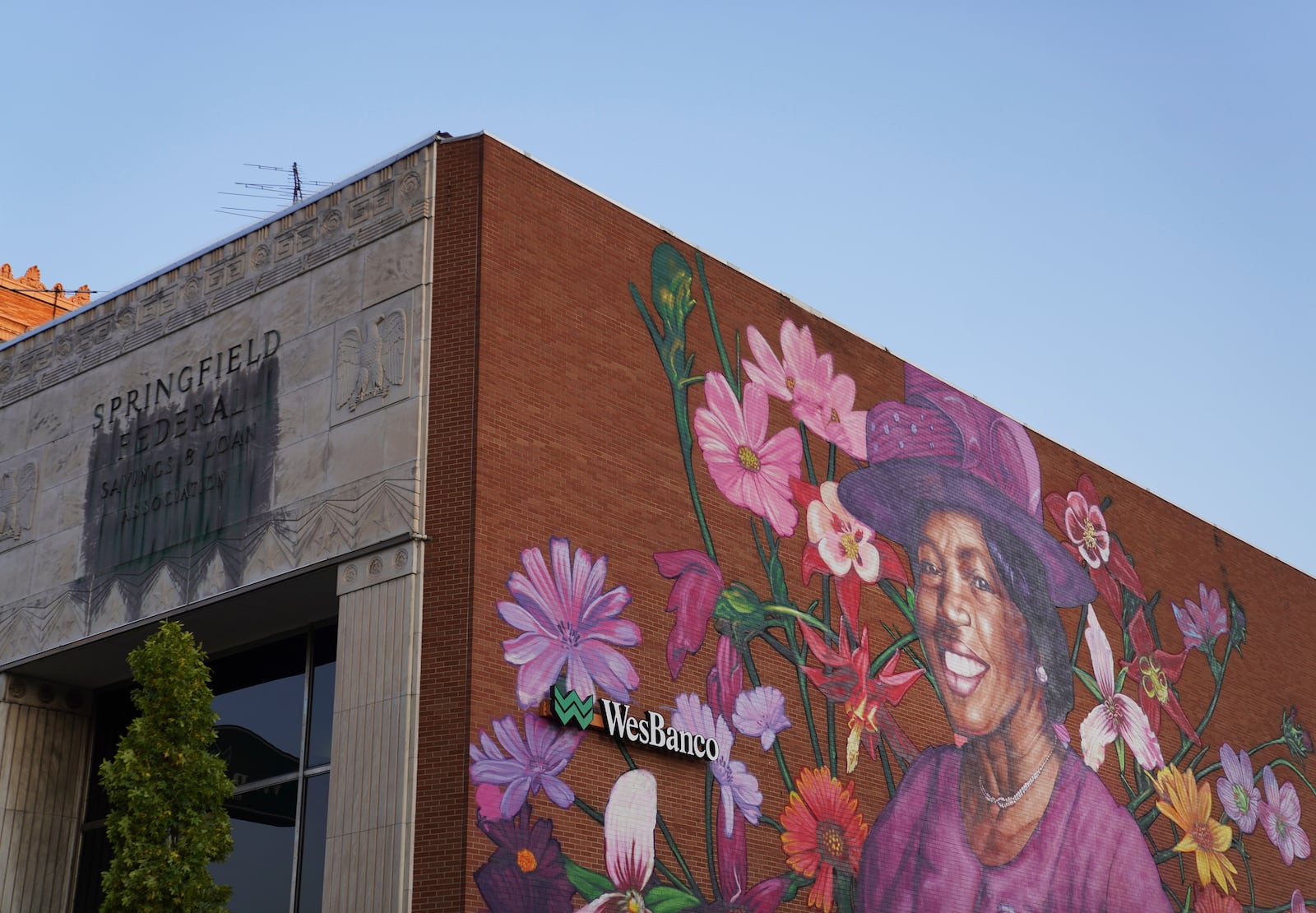 A mural depicting Hattie Moseley, a Springfield Civil Rights activist who was instrumental in battling the segregation of Fulton Elementary School, is painted on the WesBanco building on East Main Street in Springfield, Ohio, Monday, Sept. 16, 2024. (AP Photo/Jessie Wardarski)