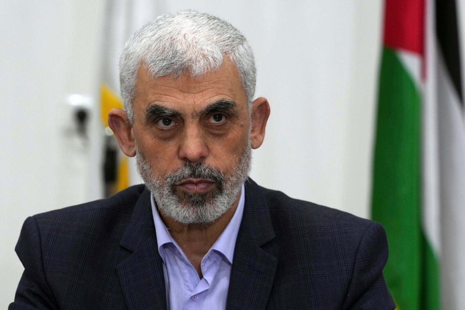 FILE - Yahya Sinwar, head of Hamas in Gaza, chairs a meeting with leaders of Palestinian factions at his office in Gaza City, on April 13, 2022. (AP Photo/Adel Hana, File)