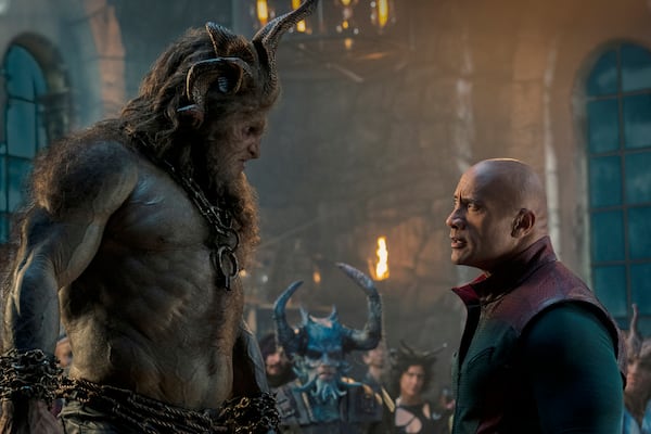 This image released by Prime shows Kristofer Hivju, left, and Dwayne Johnson in a scene from "Red One." (Frank Masi/Prime via AP)