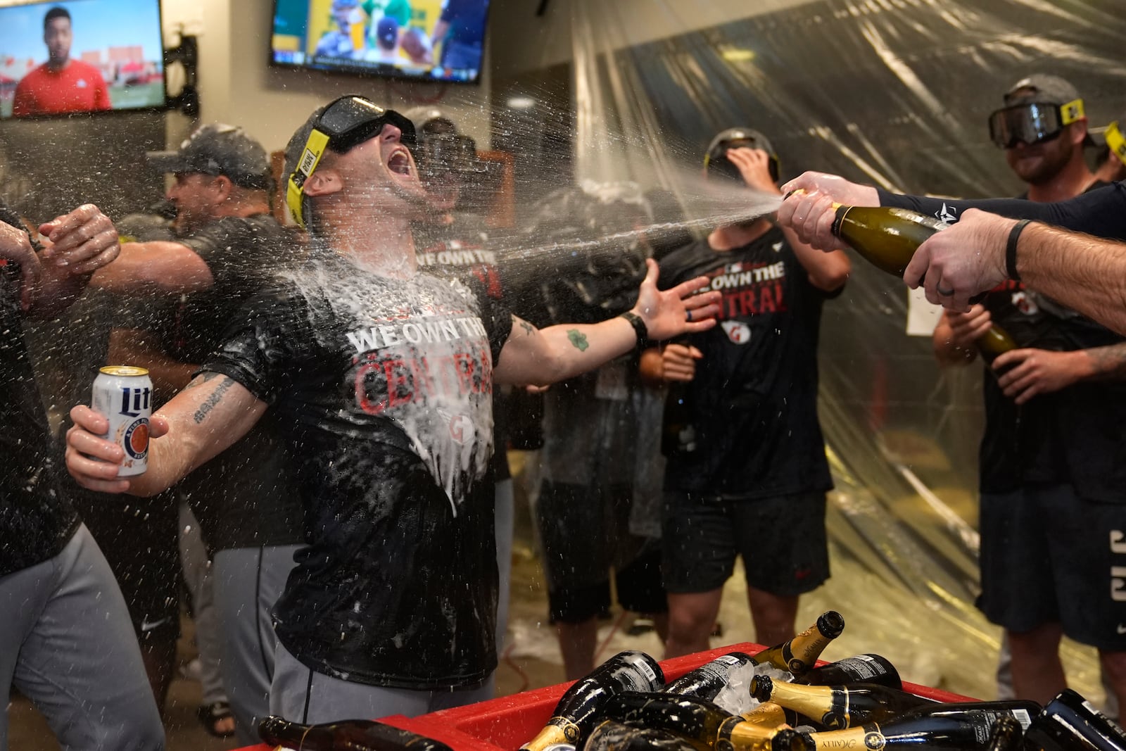 Members of the Cleveland Guardians celebrate winning the American League Central following a baseball game against the St. Louis Cardinals Saturday, Sept. 21, 2024, in St. Louis. (AP Photo/Jeff Roberson)