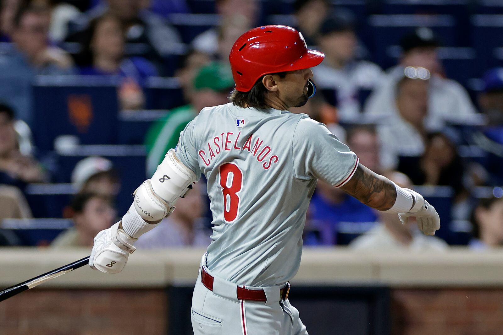 Philadelphia Phillies' Nick Castellanos hits an RBI double during the third inning of a baseball game against the New York Mets, Friday, Sept. 20, 2024, in New York. (AP Photo/Adam Hunger)