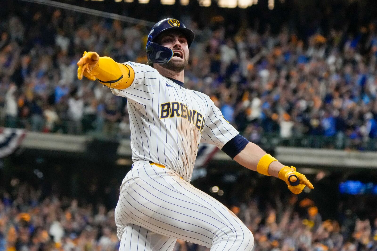 Milwaukee Brewers' Garrett Mitchell celebrates afrer hitting a two-run home run during the eighth inning of Game 2 of a National League wild card baseball game against the New York Mets Wednesday, Oct. 2, 2024, in Milwaukee. (AP Photo/Morry Gash)