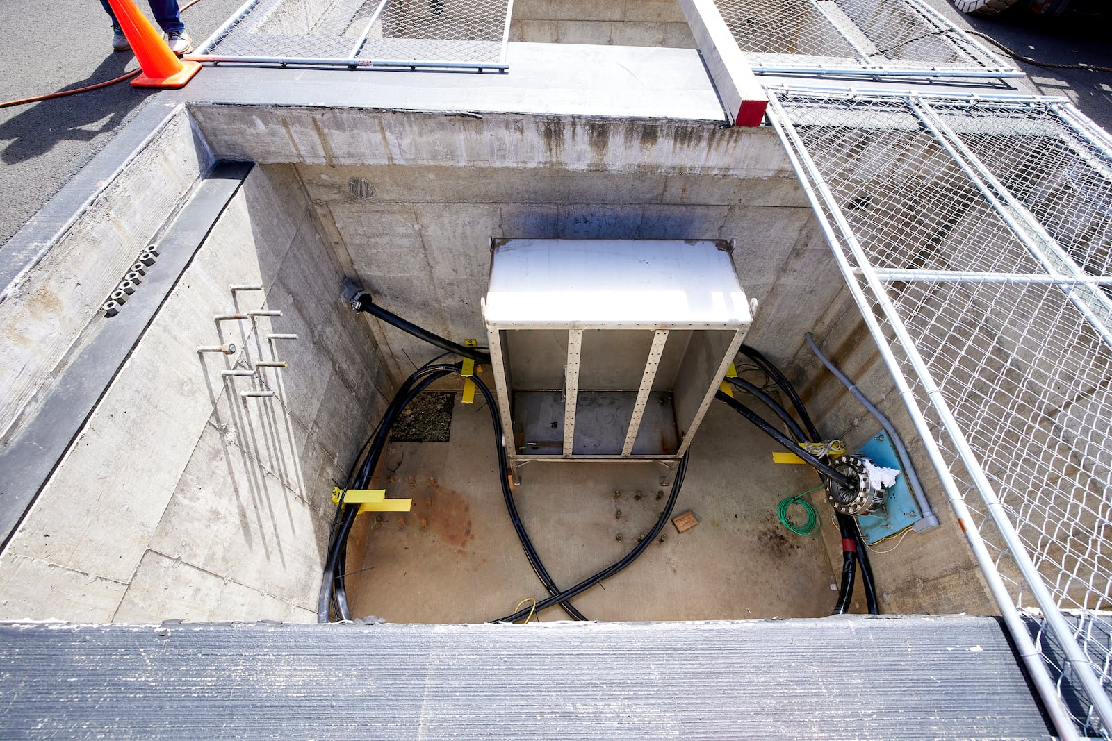 Concrete vaults under the parking lot at Driftwood State Beach where subsea cables connected to the wave energy test site arrive on land and connect to land cables in Newport, Ore., Friday, Aug. 23, 2024. (AP Photo/Craig Mitchelldyer)