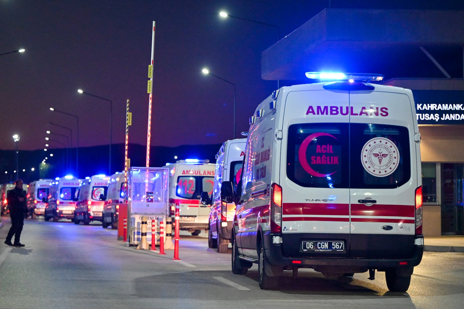 Ambulances wait in line outside of Turkish Aerospace Industries Inc. at the outskirts of Ankara, Turkey, Wednesday, Oct. 23, 2024. (AP Photo/Mert Gokhan Koc)