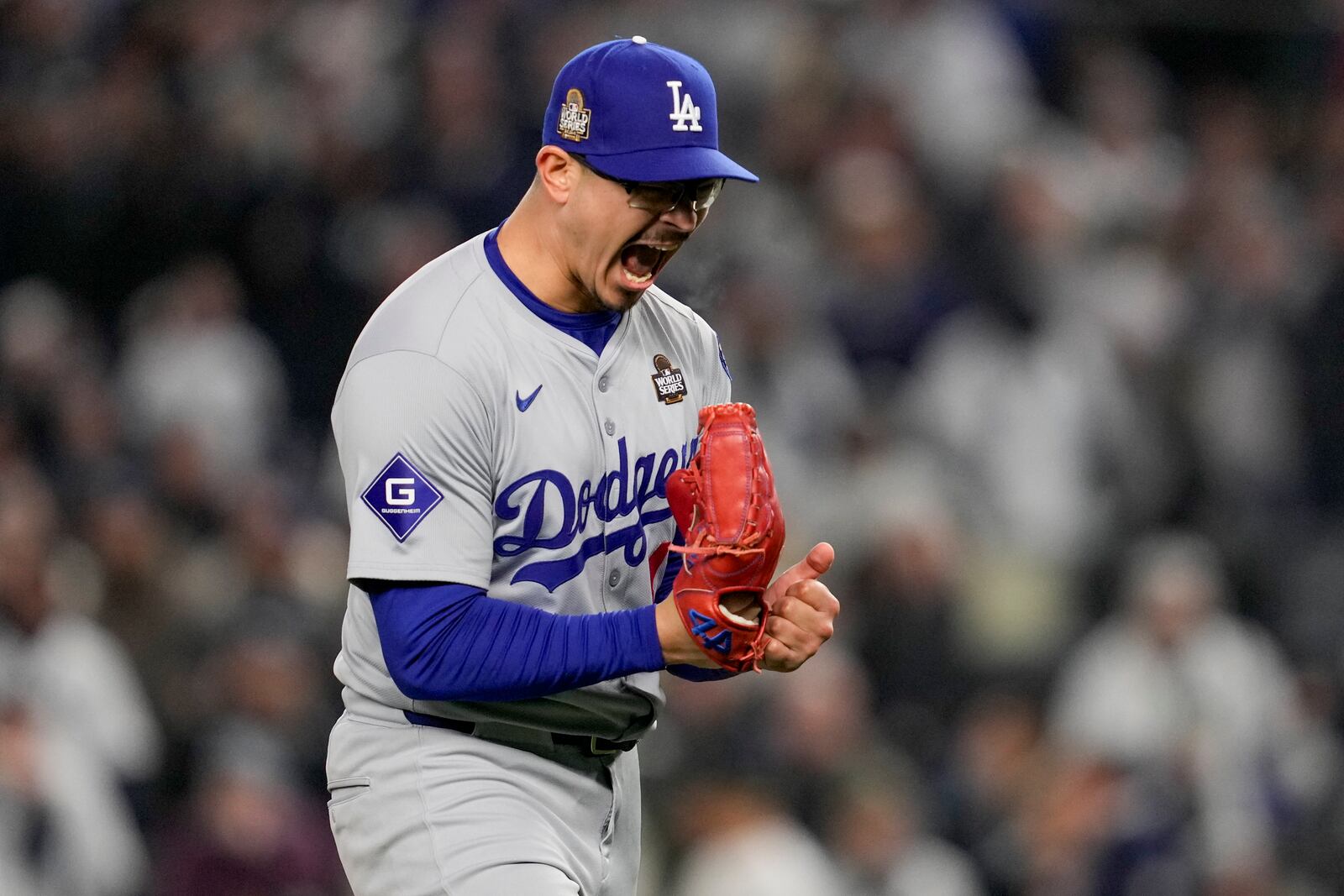 Los Angeles Dodgers pitcher Anthony Banda celebrates the end of the seventh inning in Game 3 of the baseball World Series against the New York Yankees, Monday, Oct. 28, 2024, in New York. (AP Photo/Ashley Landis)