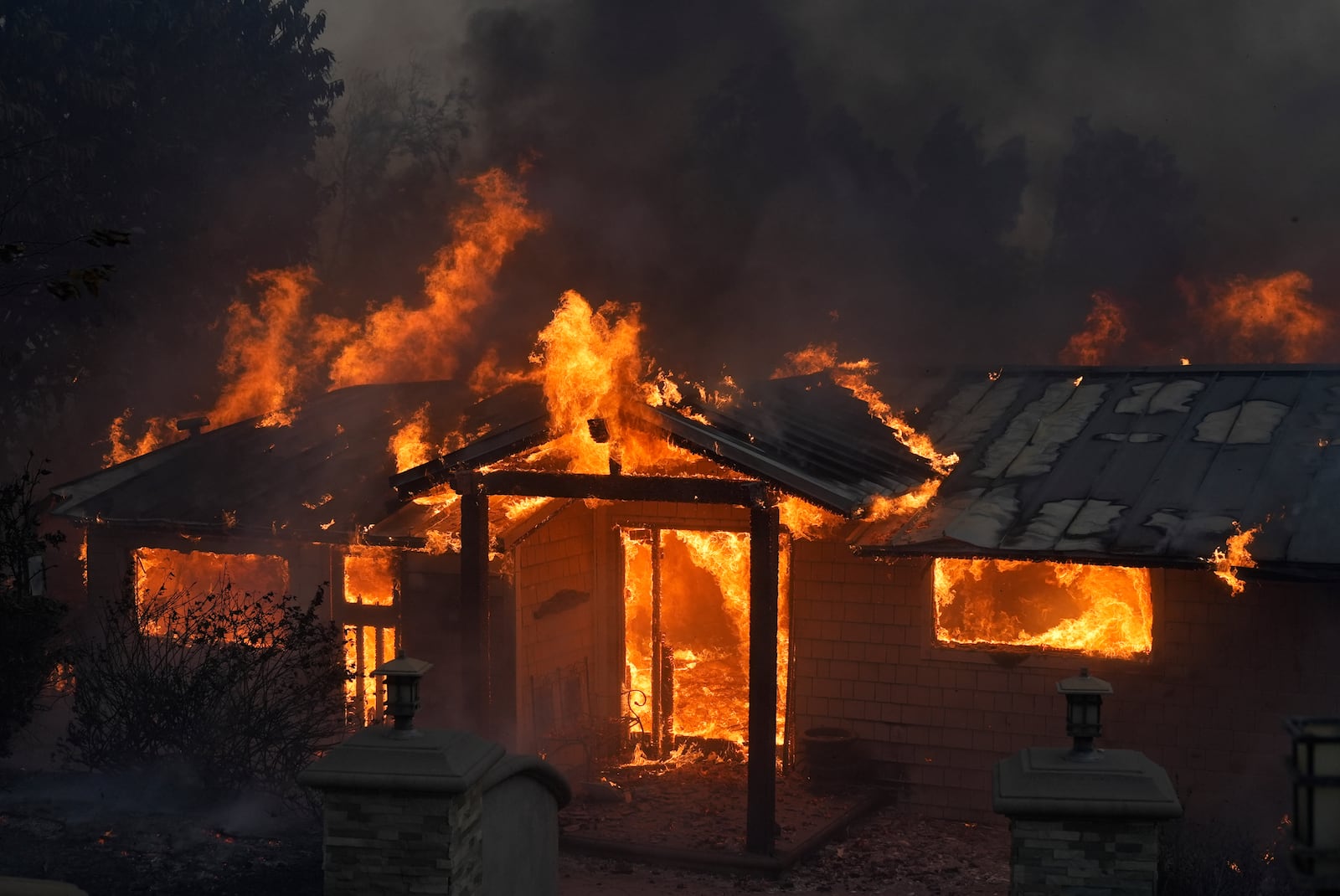 A home burns in the Mountain fire, Wednesday, Nov. 6, 2024, near Camarillo, Calif. (AP Photo/Marcio Jose Sanchez)