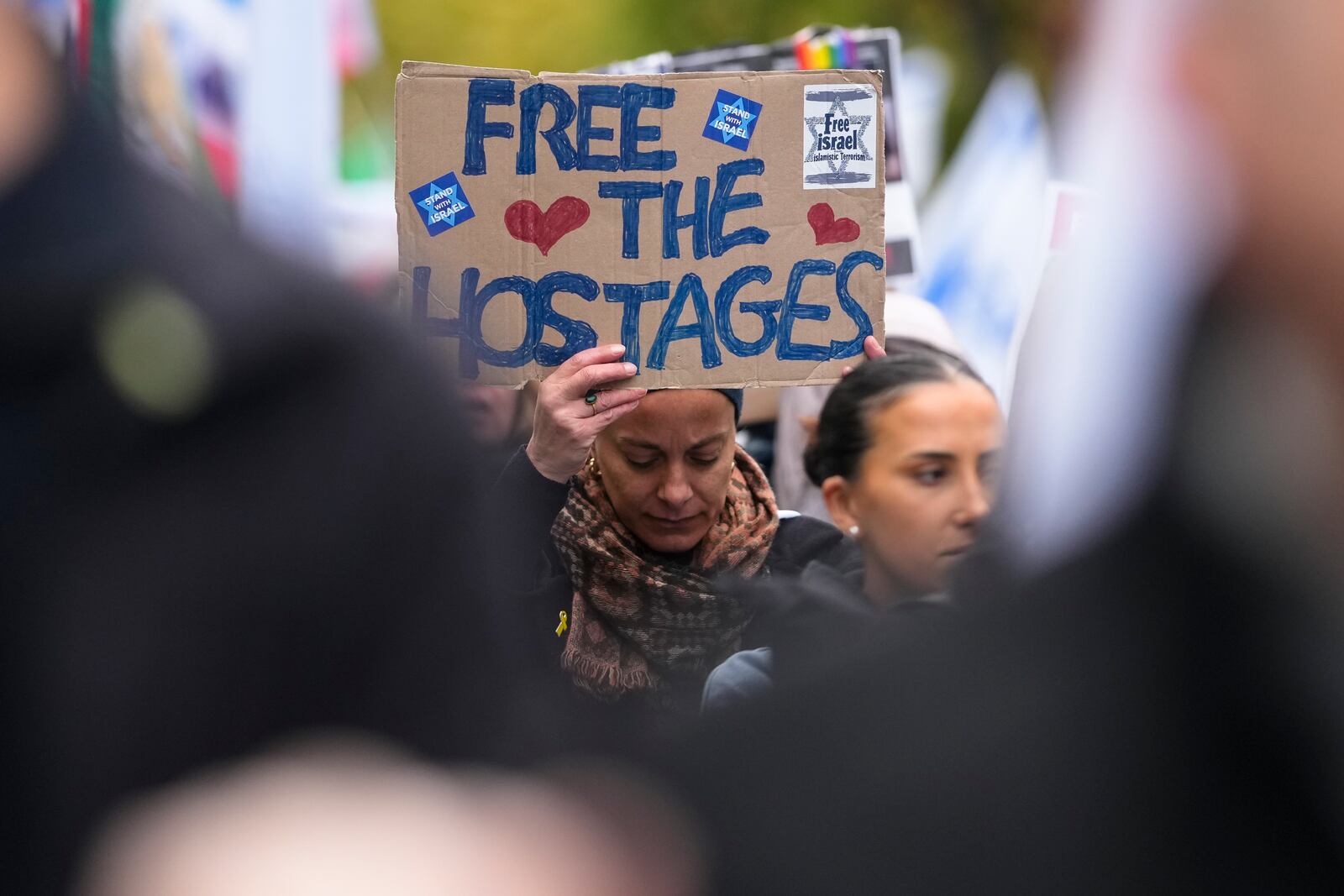 People attend a demonstration in support of Israel to mark the first anniversary of the Hamas attack on Israel, in Berlin, Germany, Sunday, Oct. 6, 2024. (AP Photo/Markus Schreiber)