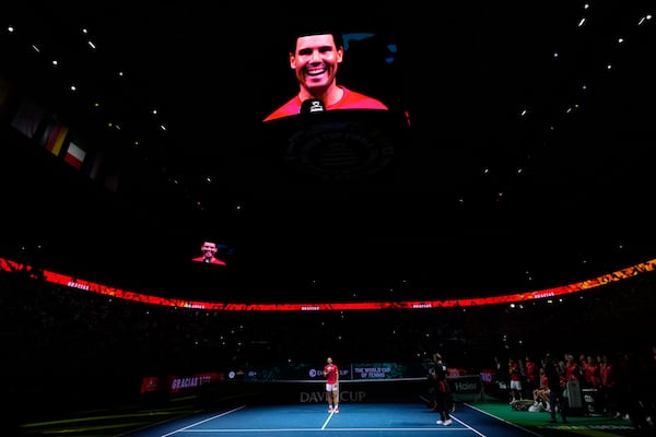 Spain's Rafael Nadal talks to the crowd during a tribute after playing his last match as a professional tennis player in the Davis Cup quarterfinals at the Martin Carpena Sports Hall in Malaga, southern Spain, on early Wednesday, Nov. 20, 2024. (AP Photo/Manu Fernandez)