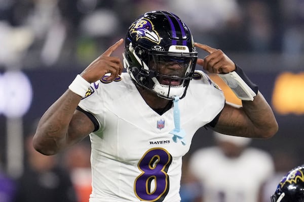 Baltimore Ravens quarterback Lamar Jackson (8) calls a play during the first half of an NFL football game against the Los Angeles Chargers, Monday, Nov. 25, 2024, in Inglewood, Calif. (AP Photo/Eric Thayer)