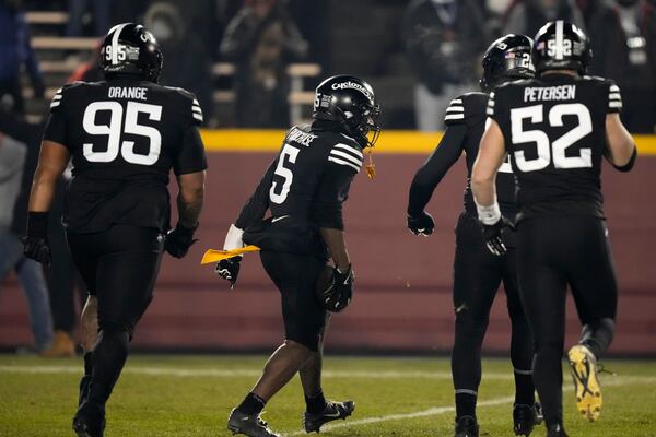 Iowa State defensive back Myles Purchase (5) celebrates with teammates after recovering a fumble during the first half of an NCAA college football game against Kansas State, Saturday, Nov. 30, 2024, in Ames, Iowa. (AP Photo/Charlie Neibergall)