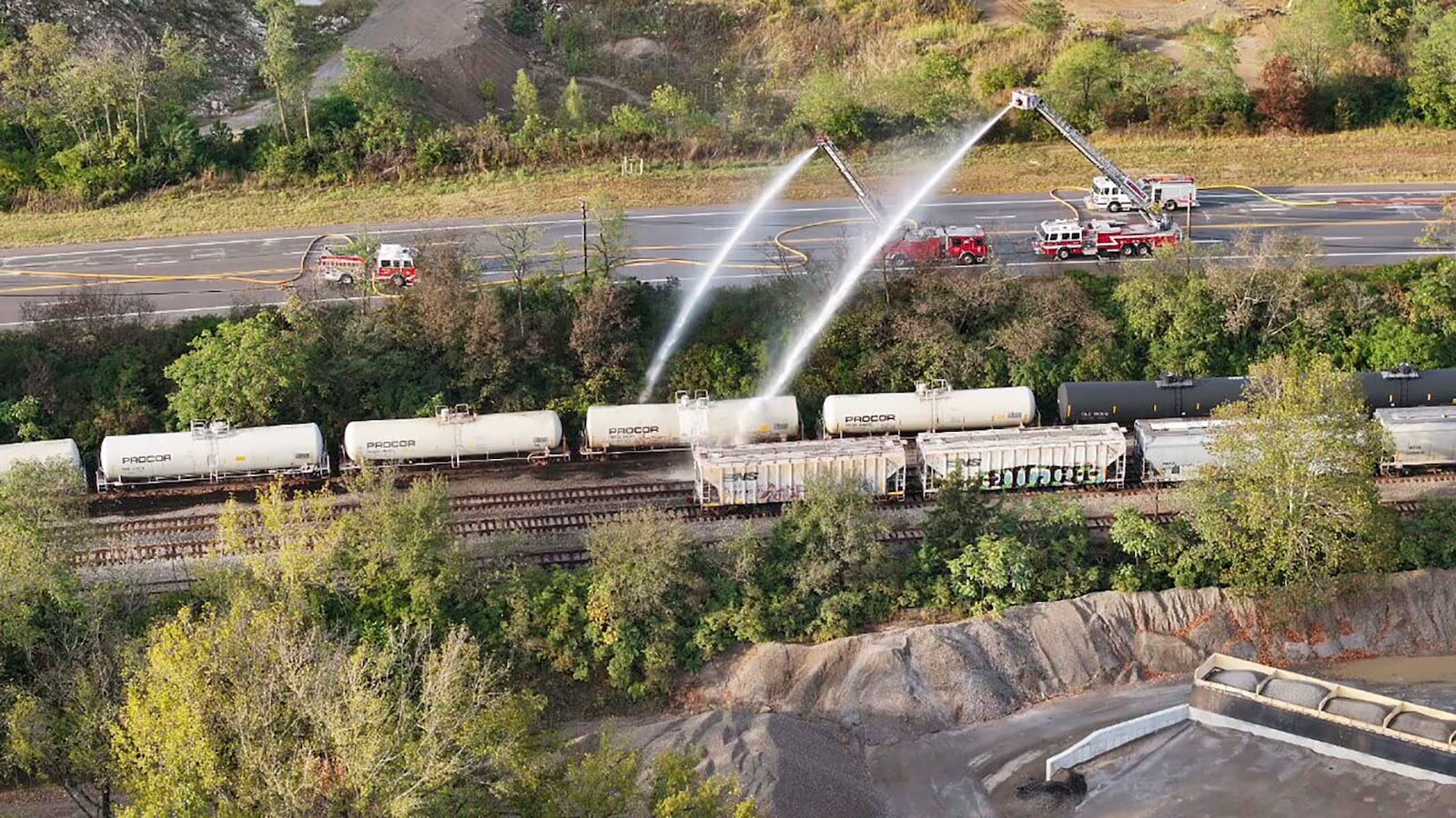 Firefighters work on the scene of a chemical leak in railcars near Cleves, Ohio, Tuesday, Sept. 24, 2024. (Local 12/WKRC via AP)