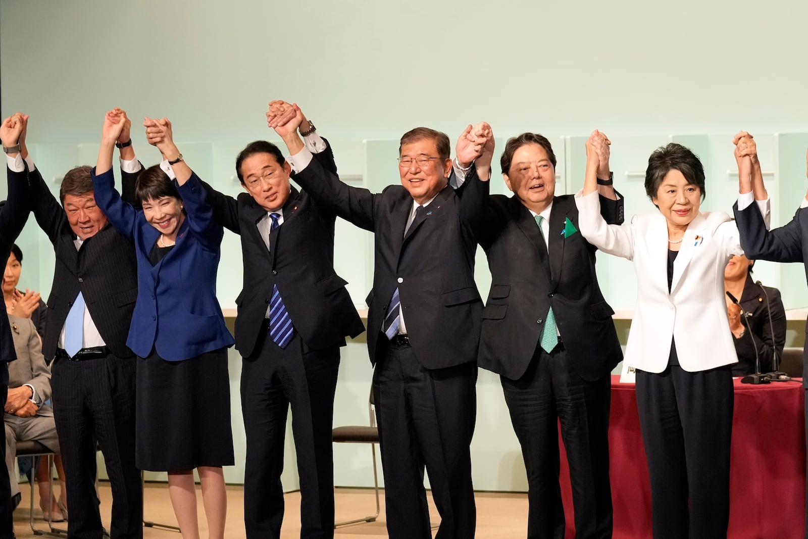 Shigeru Ishiba, center, celebrates after he was elected as new head of Japan's ruling party at the Liberal Democratic Party's leadership election Friday, Sept. 27, 2024, in Tokyo. (AP Photo/Hiro Komae, Pool)