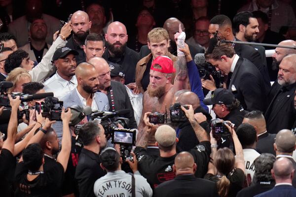 Jake Paul celebrates after defeating Mike Tyson during their heavyweight boxing match, Friday, Nov. 15, 2024, in Arlington, Texas. (AP Photo/Julio Cortez)