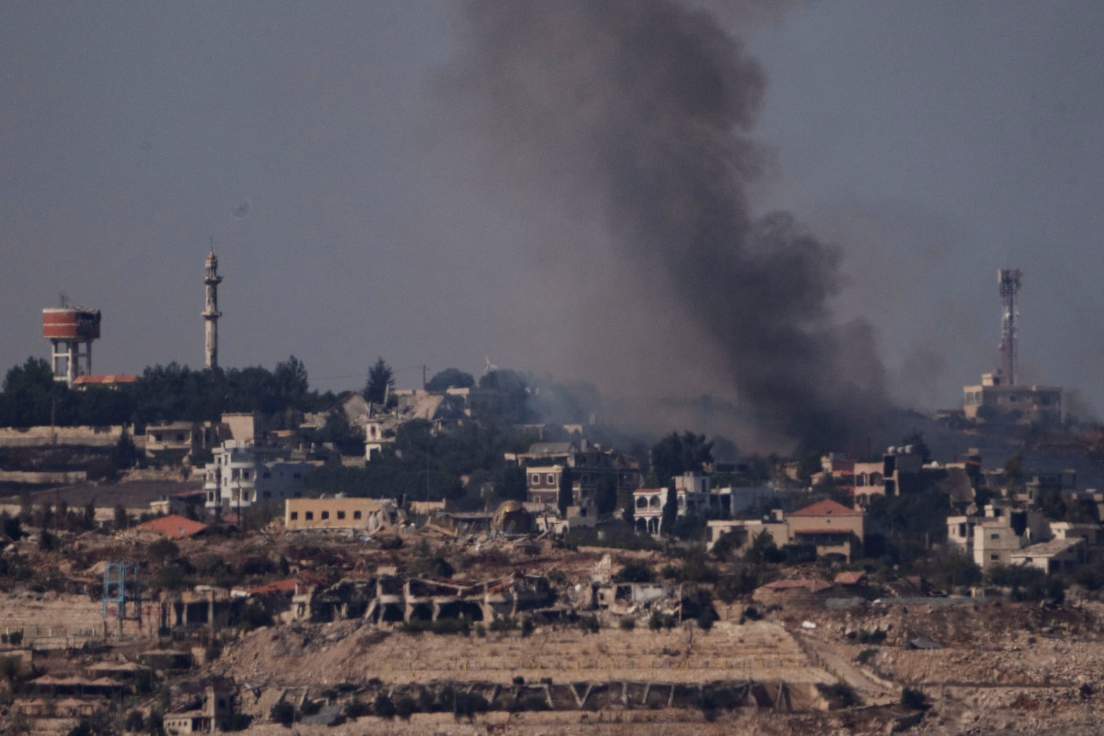 Smoke rises from a fire in southern Lebanon as seen from northern Israel, Saturday, Oct. 5, 2024. (AP Photo/Leo Correa)