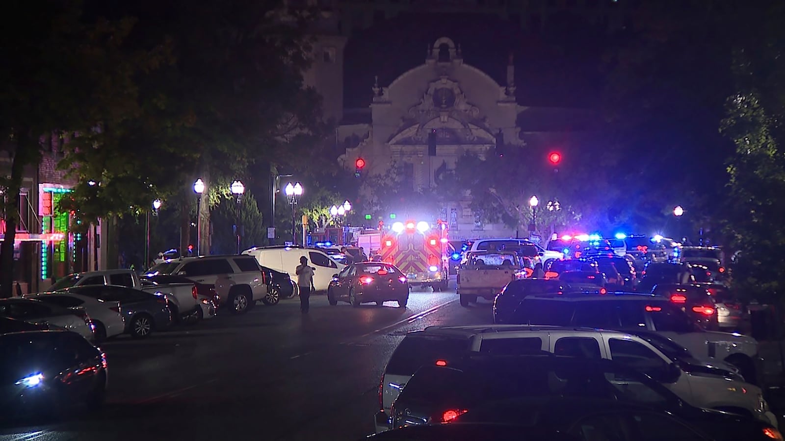 This image provided by WBMA shows police and emergency vehicles in the entertainment district after a shooting in Birmingham, Ala., Sunday, Sept. 22, 2024. (Bill Castle/WBMA via AP)