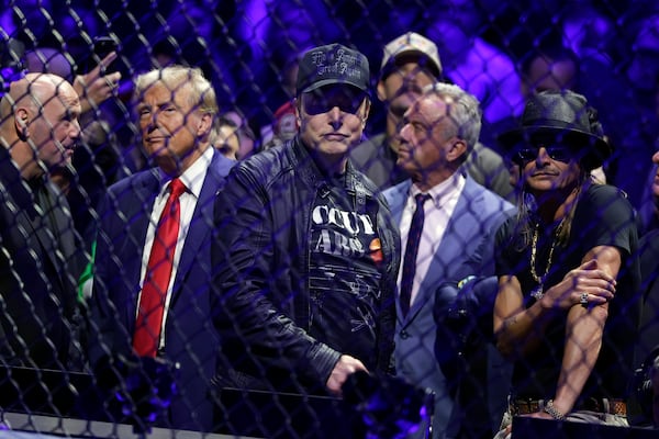 President-elect Donald Trump talks to CEO of UFC Dana White, left, as Elon Musk, second right, looks on at the UFC 309 mixed martial arts event, Saturday, Nov. 16, 2024, in New York. (AP Photo/Adam Hunger)