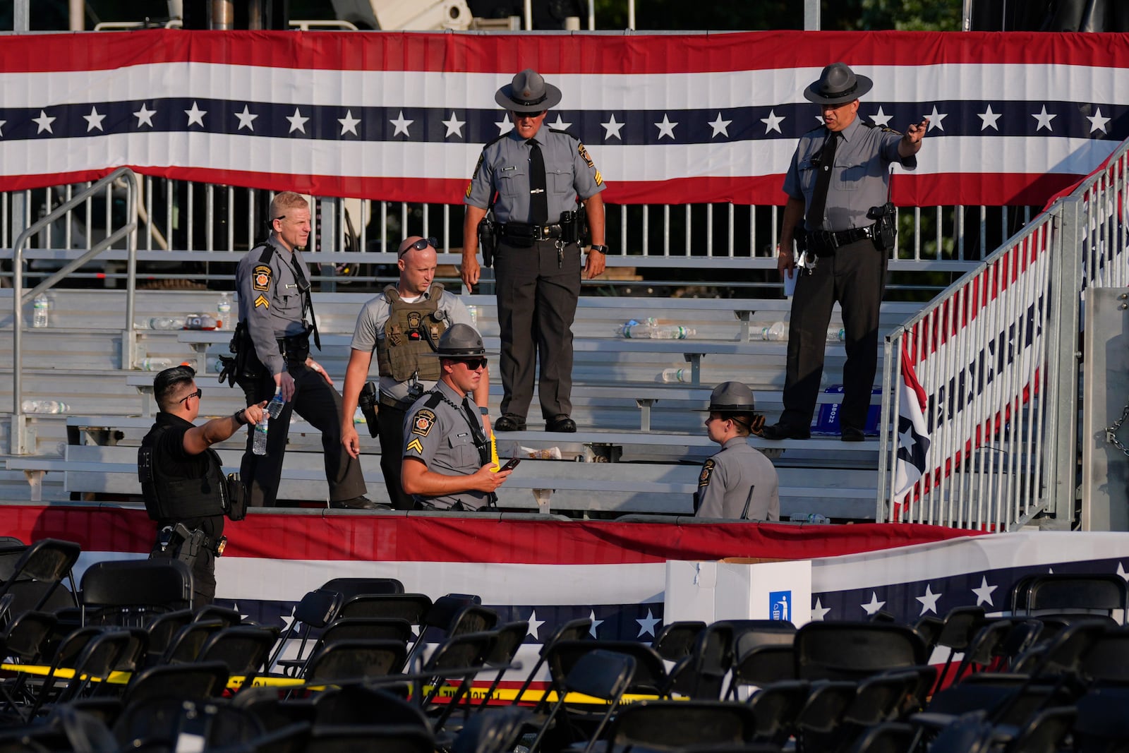 FILE - Law enforcement officers gather at the campaign rally site for Republican presidential candidate former President Donald Trump July 13, 2024, in Butler, Pa.(AP Photo/Evan Vucci, File)