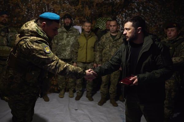 In this photo provided by the Ukrainian Presidential Press Office, Ukrainian President Volodymyr Zelenskyy awards servicemen in the frontline city of Pokrovsk, the site of heaviest battles with the Russian troops in the Donetsk region, Ukraine, Monday, Nov. 18, 2024. (Ukrainian Presidential Press Office via AP)