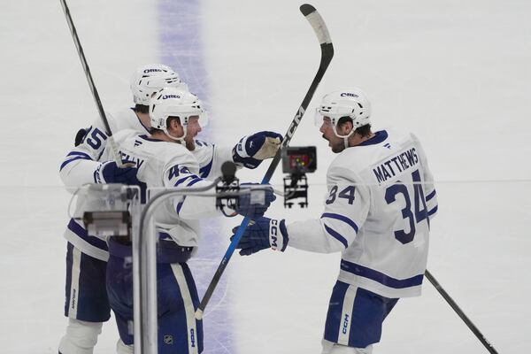 Toronto Maple Leafs defenseman Morgan Rielly (44) celebrates a goal during the third period in Game 3 of a second-round NHL hockey playoff series against the Florida Panthers, Friday, May 9, 2025, in Sunrise, Fla. (AP Photo/Marta Lavandier)
