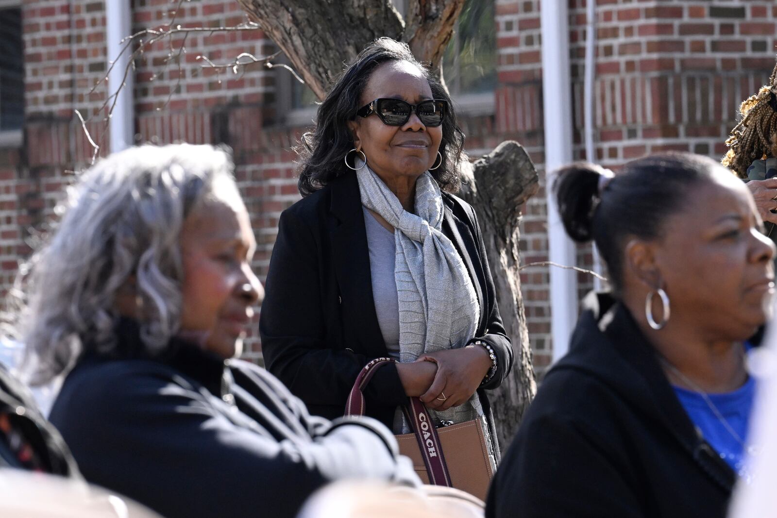 Carolyn Highsmith, a member of Theta Epsilon Omega Chapter of Alpha Kappa Alpha Sorority in New Haven, listens to speakers at a Souls to the Polls voting rally at Grace Baptist Church Saturday, Oct. 26, 2024, in Waterbury, Conn. (AP Photo/Jessica Hill)