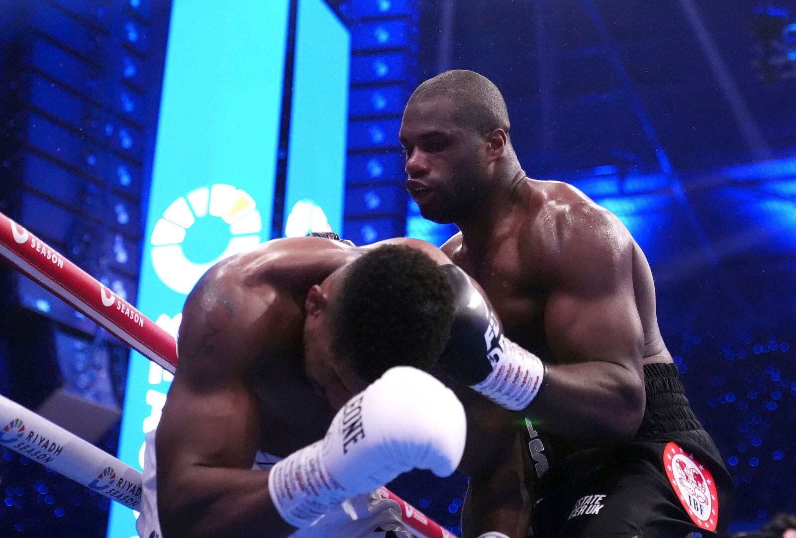 Daniel Dubois, right, knocks down Anthony Joshua in the IBF World Heavyweight bout at Wembley Stadium, in London, Saturday Sept. 21, 2024. (Bradley Collyer/PA via AP)