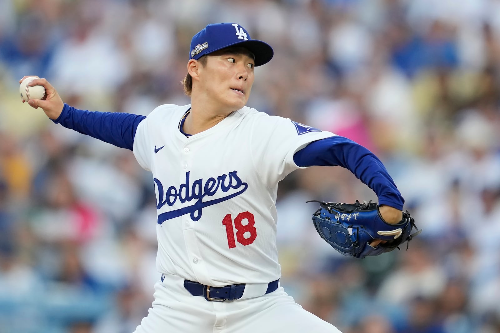 Los Angeles Dodgers pitcher Yoshinobu Yamamoto throws to a San Diego Padres batter during the first inning in Game 1 of baseball's NL Division Series against the San Diego Padres, Saturday, Oct. 5, 2024, in Los Angeles. (AP Photo/Ashley Landis)