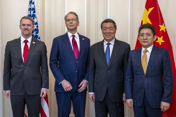 U.S. Secretary of the Treasury Scott Bessent, center left, U.S. Trade Representative Jamieson Greer, left, Chinese Vice Premier He Lifeng, center right, and Chinese ambassador to the World Trade Organization Li Chenggang, right, pose for a photo during a bilateral meeting between the United States and China, in Geneva, Switzerland, on Saturday, May 10, 2025. (Martial Trezzini/Keystone via AP)