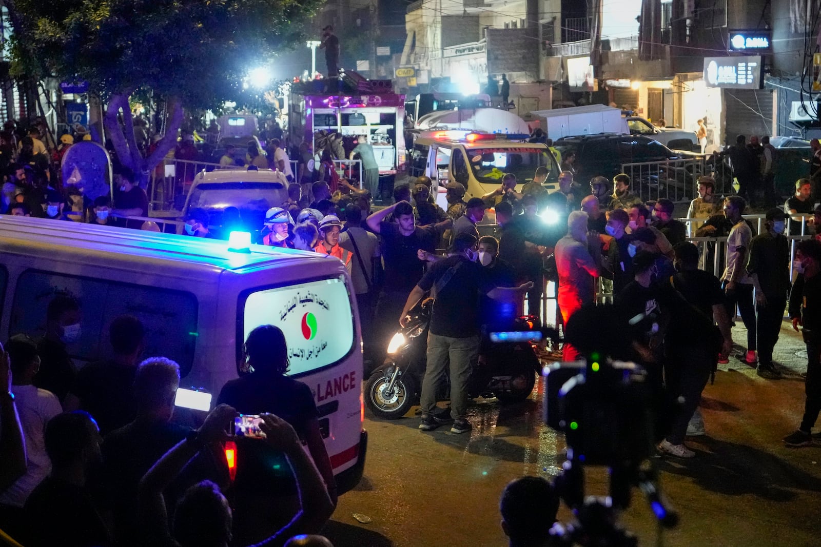 Rescuers work at the scene of an Israeli missile strike in the southern suburbs of Beirut, Friday, Sept. 20, 2024. (AP Photo/Hassan Ammar)