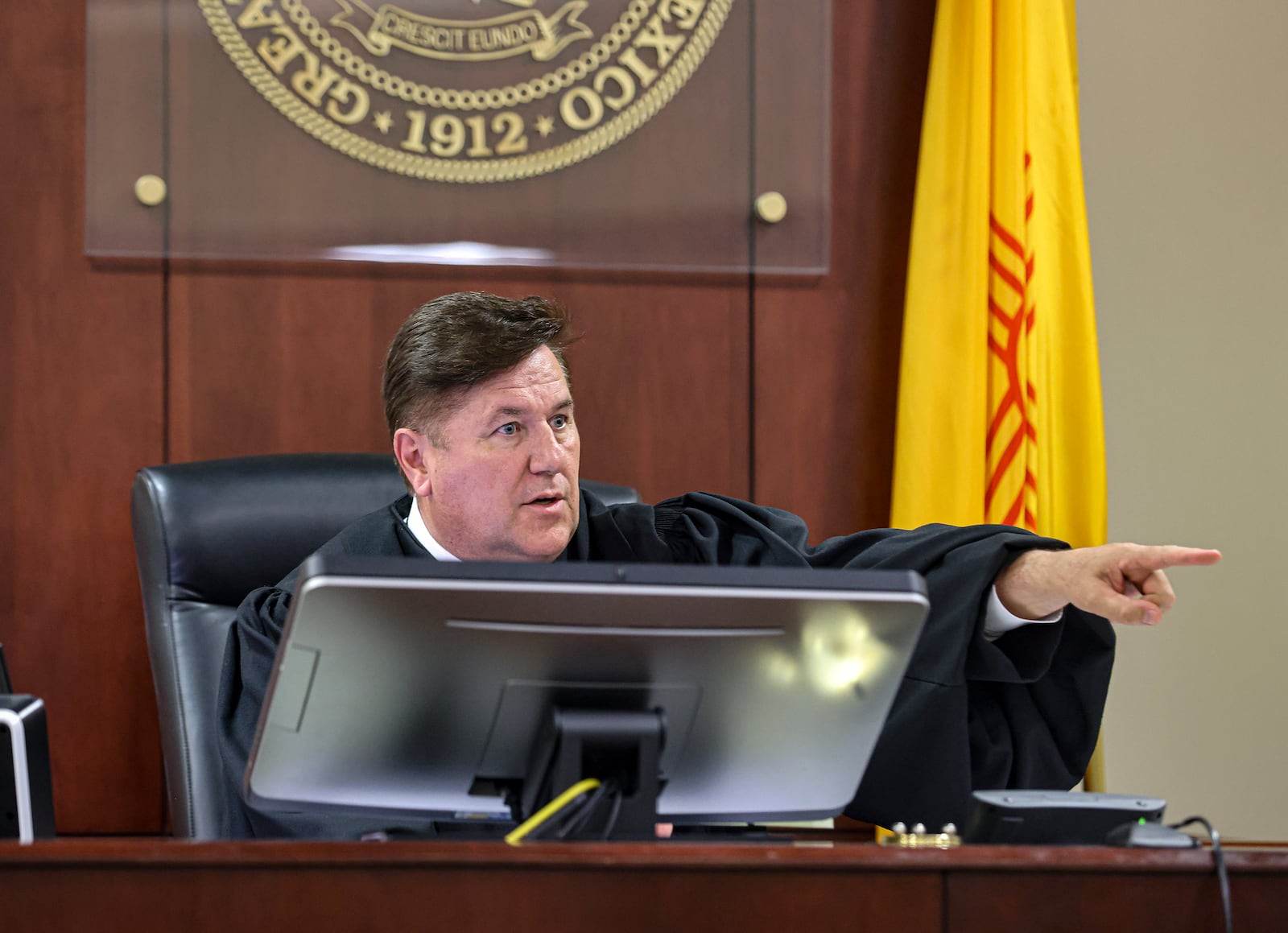 Judge T. Glenn Ellington speaks to Hannah Gutierrez-Reed, the weapons supervisor on the set of the Western film “Rust," and her lawyer Jason Bowles during a plea hearing at the First Judicial District Courthouse in Santa Fe, N.M., Monday, Oct. 7, 2024. (Gabriela Campos/Santa Fe New Mexican via AP, Pool)