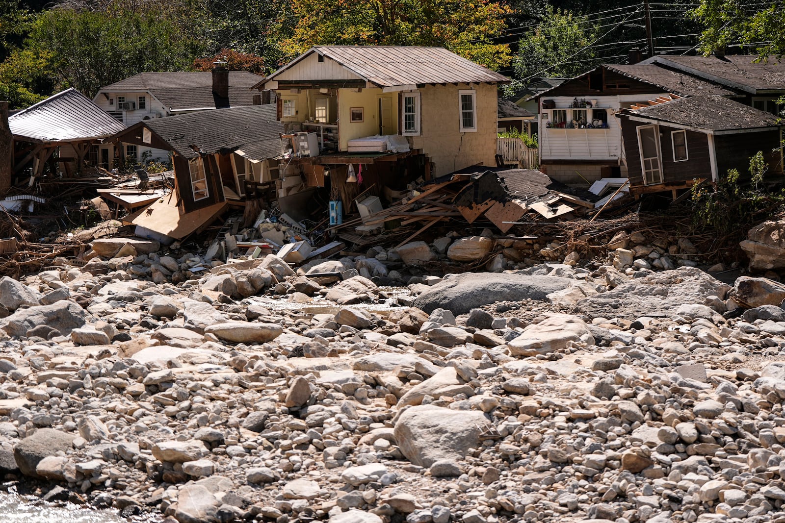 Homes are seen in the aftermath of Hurricane Helene, Wednesday, Oct. 2, 2024, in Chimney Rock Village, N.C. (AP Photo/Mike Stewart)