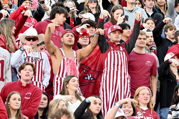 Arkansas fans react as Texas takes the field to before the start of an NCAA college football game Saturday, Nov. 16, 2024, in Fayetteville, Ark. (AP Photo/Michael Woods)