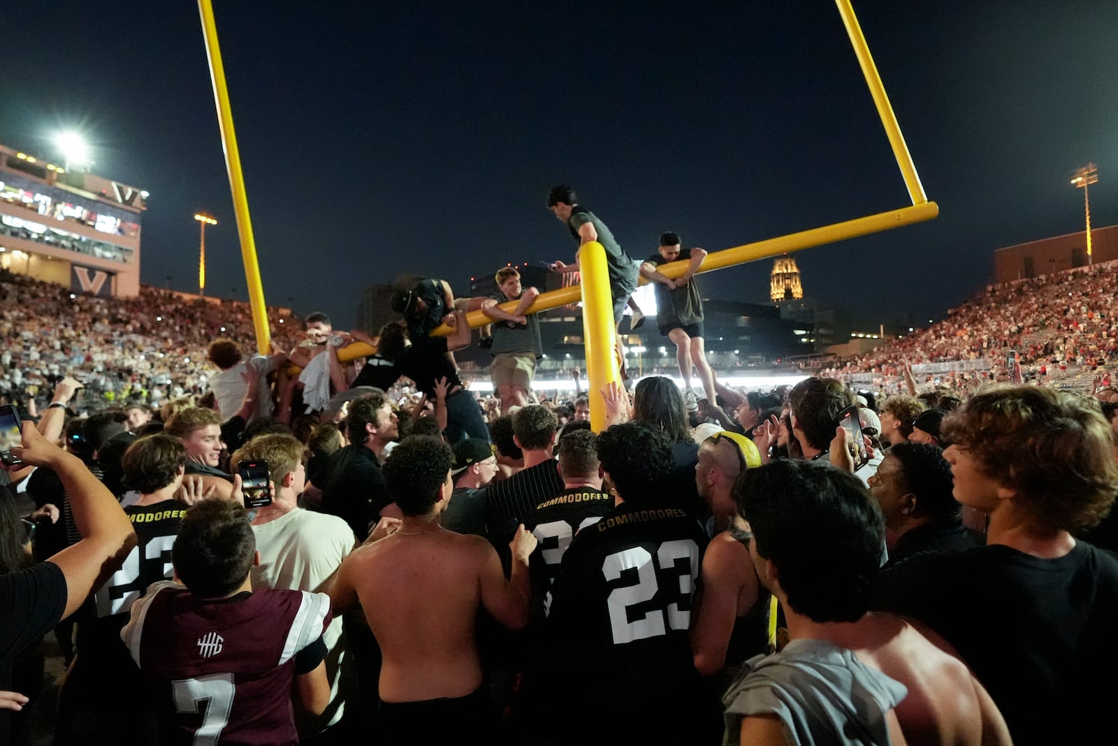 Vanderbilt fans tear down the goal post the after team's 40-35 win against Alabama in an NCAA college football game Saturday, Oct. 5, 2024, in Nashville, Tenn. (AP Photo/George Walker IV)