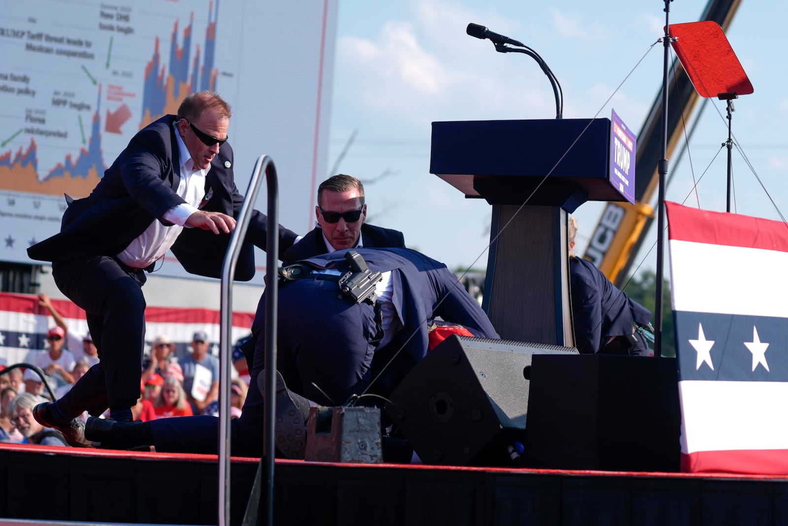 FILE - U.S. Secret Service agents converge to cover Republican presidential candidate former President Donald Trump at a campaign rally, July 13, 2024, in Butler, Pa. (AP Photo/Evan Vucci, File)