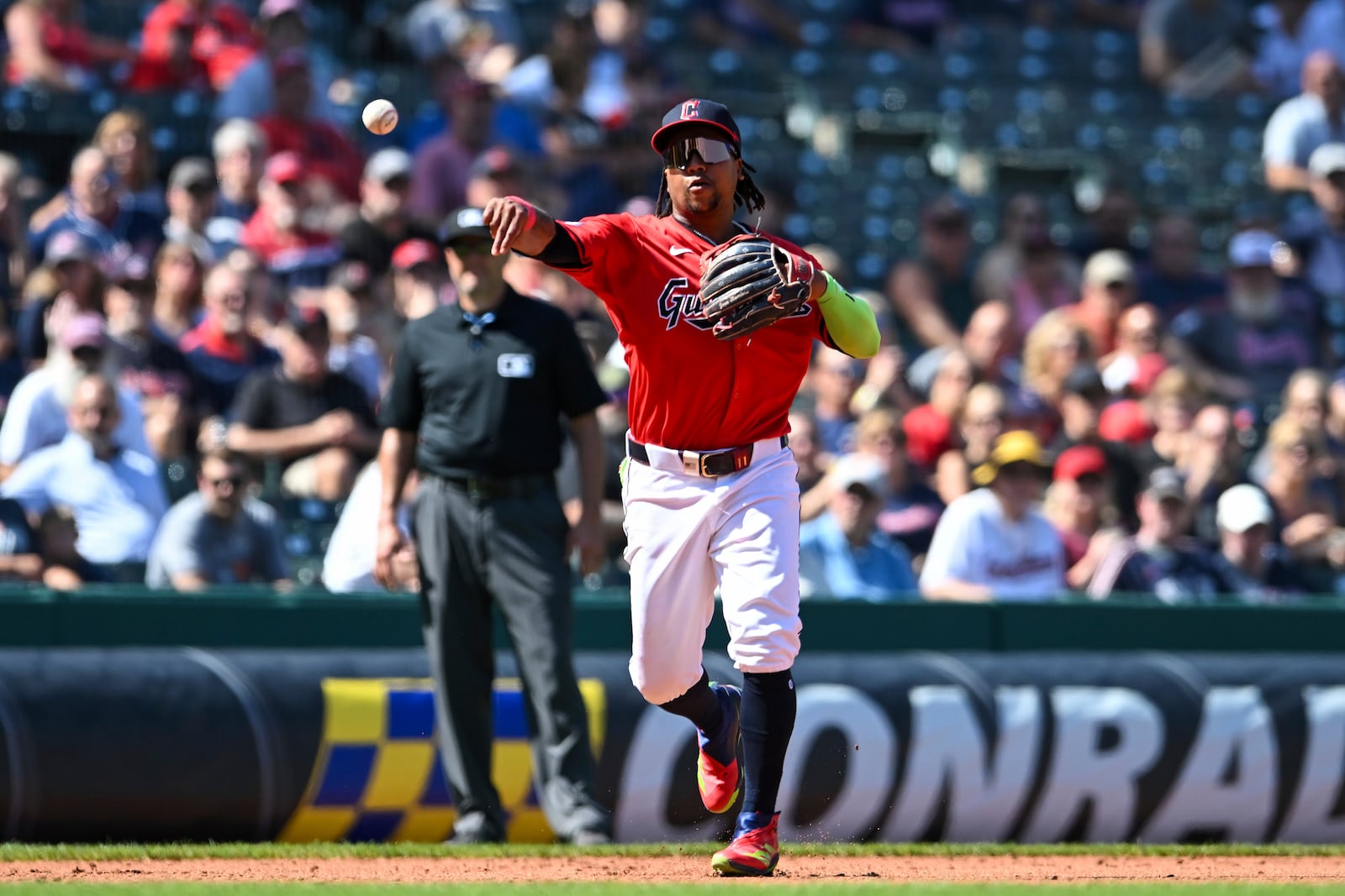 Cleveland Guardians' José Ramírez throws out Minnesota Twins' Carlos Santana at first base during the fourth inning of a baseball game, Thursday, Sept. 19, 2024, in Cleveland. (AP Photo/Nick Cammett)