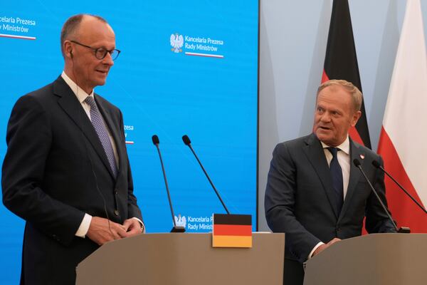 Polish Prime Minister Donald Tusk, right, and German Chancellor Friedrich Merz attend a joint press conference following their meeting in Warsaw, Poland, Wednesday, May 7, 2025. (AP Photo/Czarek Sokolowski)