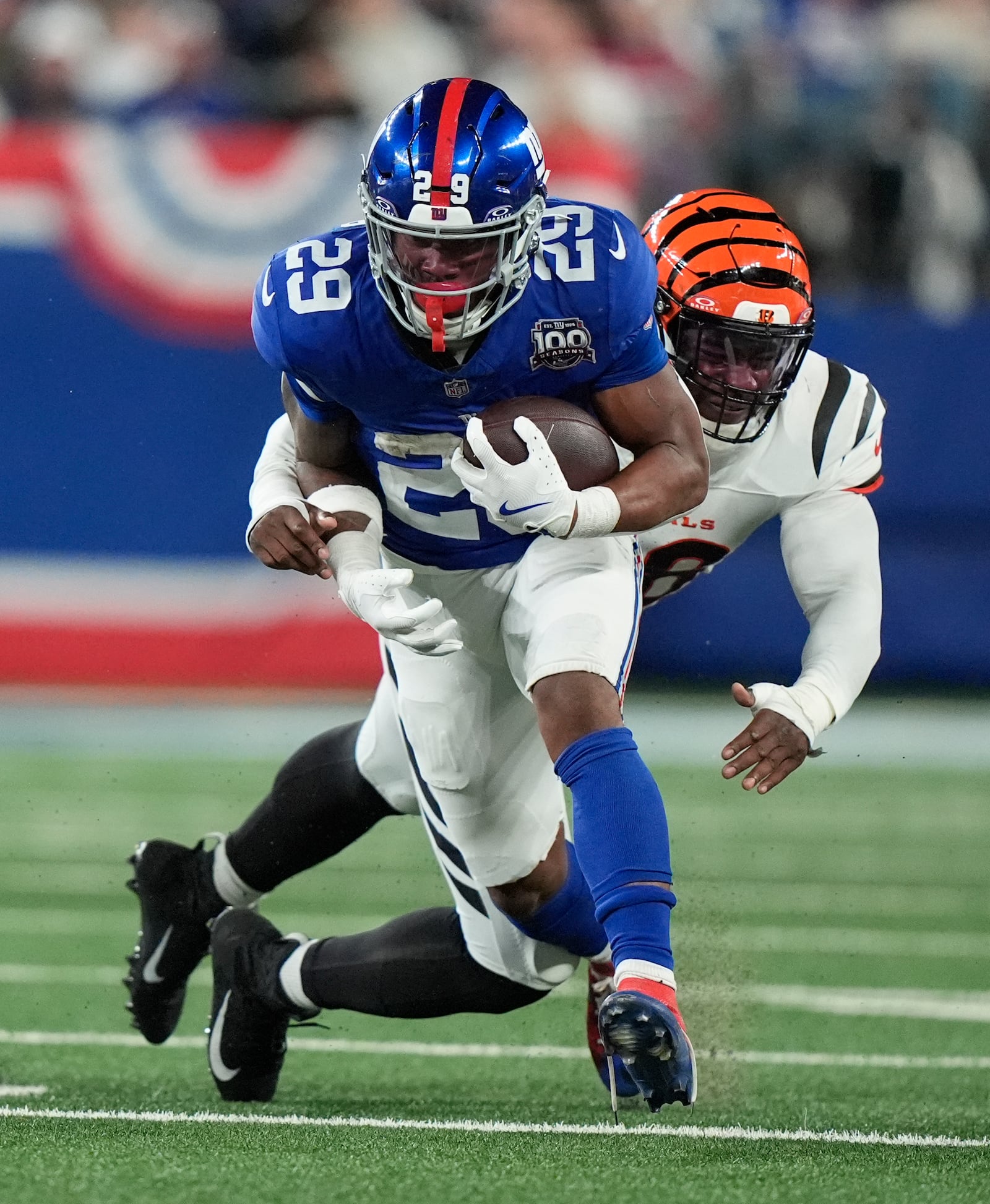 New York Giants cornerback Cor'Dale Flott (28) runs past Cincinnati Bengals defensive end Joseph Ossai (58) during the second half of an NFL football game, Sunday, Oct. 13, 2024, in East Rutherford, N.J. (AP Photo/Frank Franklin II)