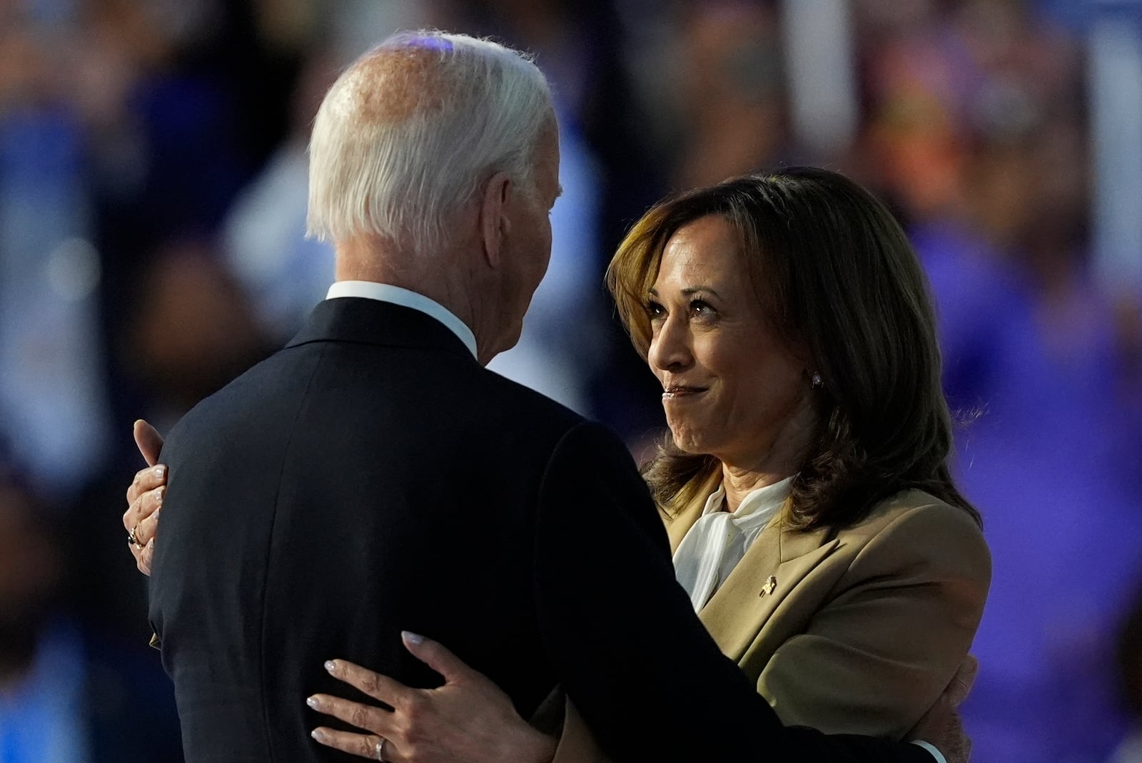 Democratic presidential nominee Vice President Kamala Harris hugs President Biden during the Democratic National Convention Monday, Aug. 19, 2024, in Chicago. (AP Photo/Charles Rex Arbogast)