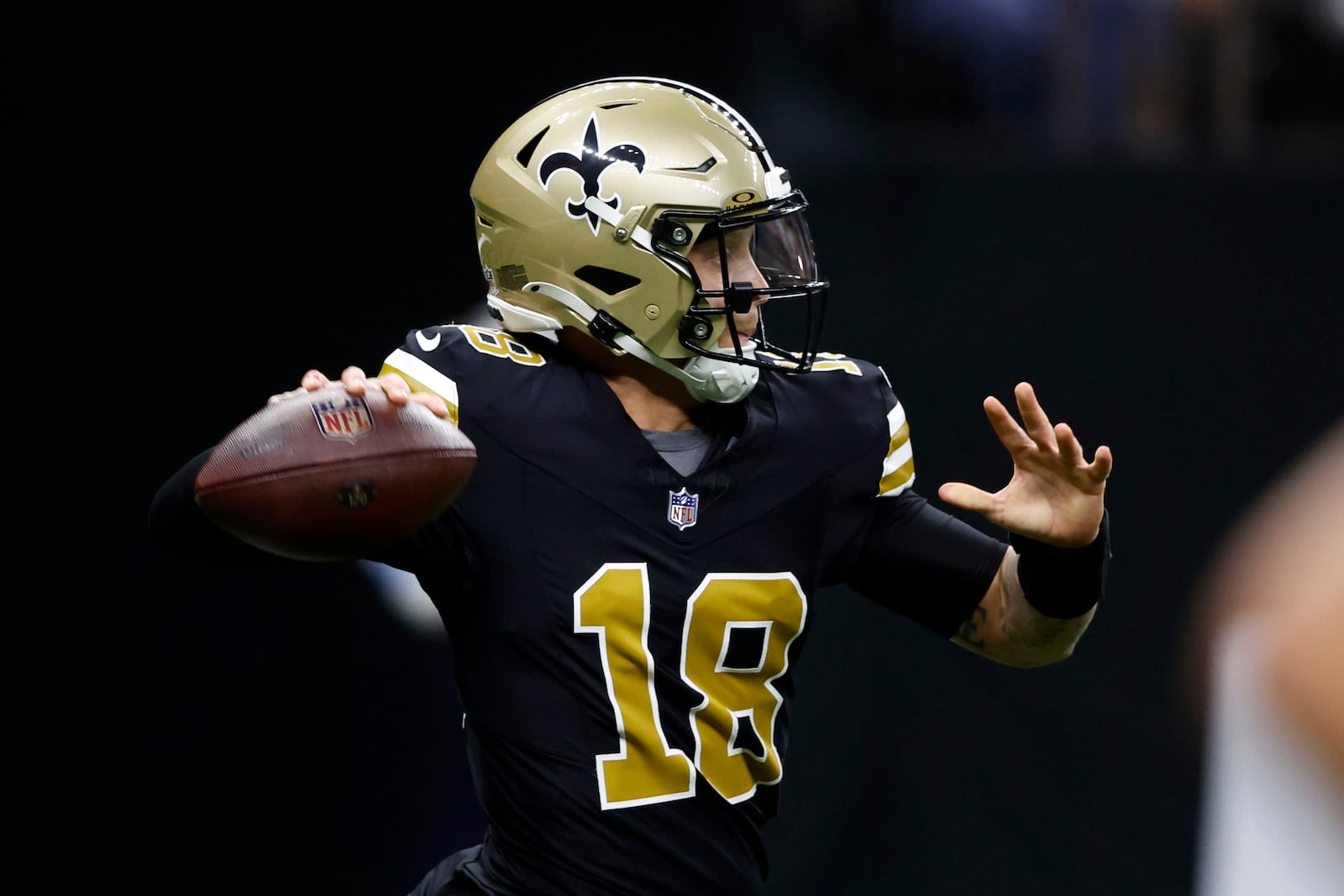 New Orleans Saints quarterback Spencer Rattler throws a pass during the first half of an NFL football game against the Denver Broncos, Thursday, Oct. 17, 2024, in New Orleans. (AP Photo/Butch Dill)