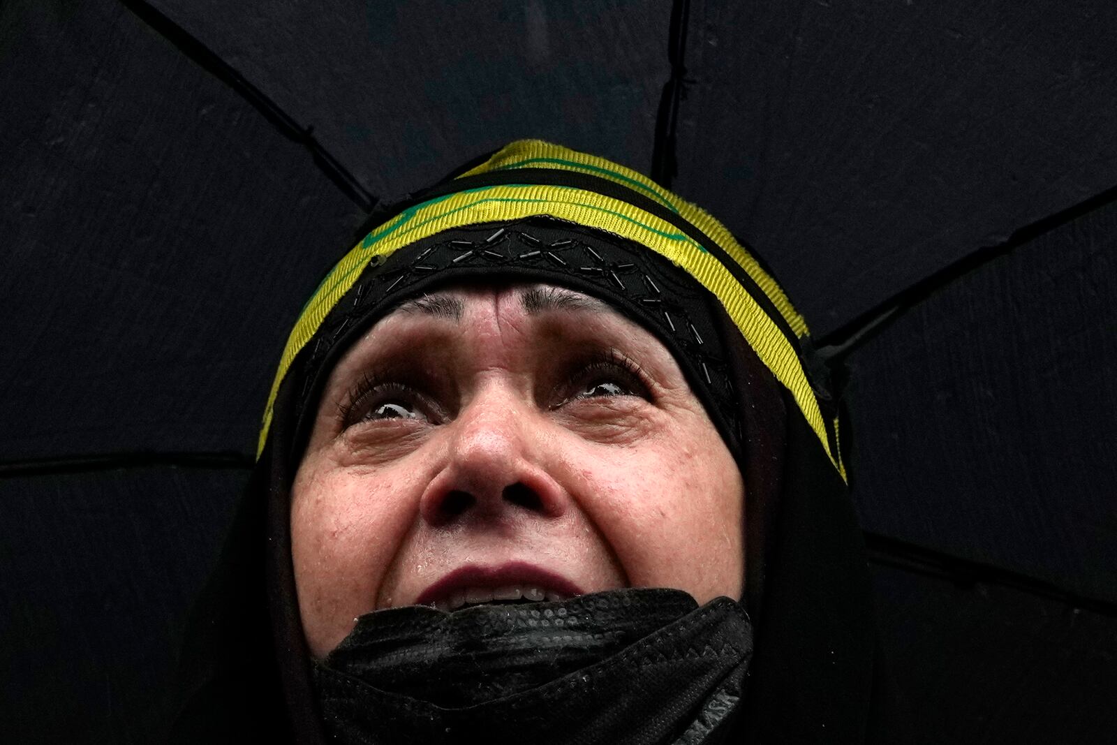 A woman weeps during a gathering in support of Lebanon's militant Hezbollah group at the Felestin (Palestine) Square in downtown Tehran, Iran, Saturday, Sept. 28, 2024. (AP Photo/Vahid Salemi)