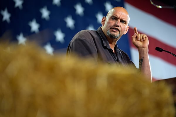 FILE - Sen. John Fetterman, D-Pa., speaks ahead of Democratic vice presidential candidate Minnesota Gov. Tim Walz during a campaign event in York, Pa., Oct. 2, 2024. (AP Photo/Matt Rourke, File)